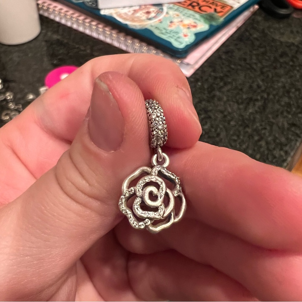 Pandora shimmering rose dangle charm.